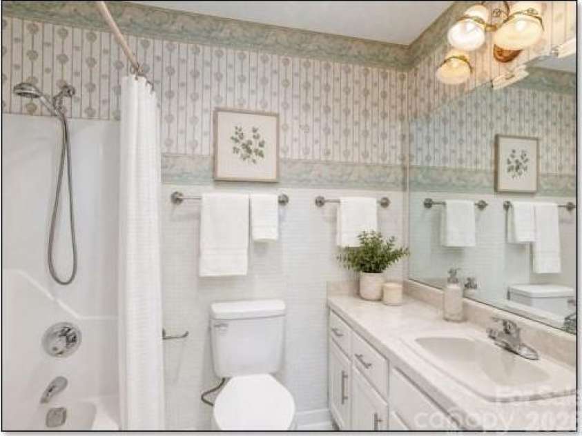 3113 Primrose Drive, Hendersonville, NC 28792.  MLS# CAR4359967, YatesRealty ID 13099. Virtually staged hall bathroom