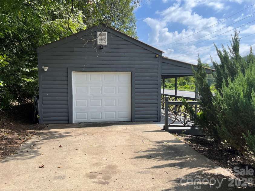 1961 Cane Creek Road, Fletcher, NC 28732.  MLS# CAR4233282, YatesRealty ID 131. Concrete pad with garage door easy access.