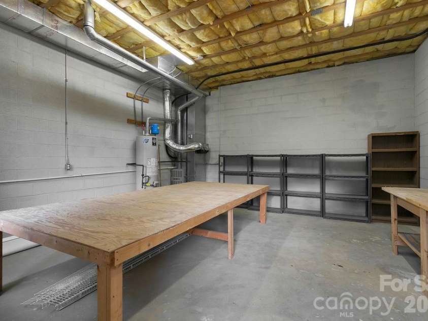 54 Wintergreen Drive, Brevard, NC 28712.  MLS# CAR4354196, YatesRealty ID 13101. Basement Storage/Workshop