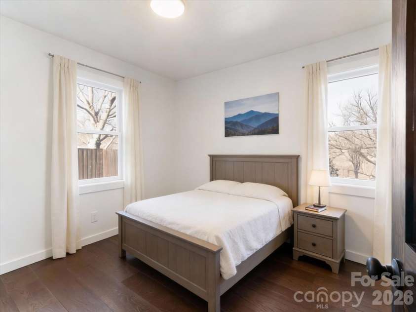 95 Loeb Drive, Brevard, NC 28712.  MLS# CAR4320988, YatesRealty ID 13104. Light Filled Primary with half bath (virtually staged)