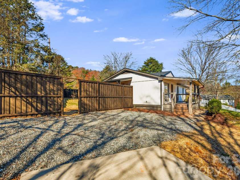 95 Loeb Drive, Brevard, NC 28712.  MLS# CAR4320988, YatesRealty ID 13104. Parking Pad next to Home