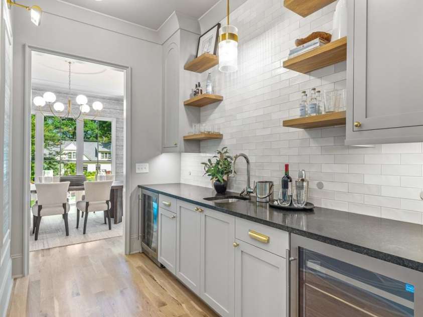 5601 Robinhood Road, Charlotte, NC 28211.  MLS# CAR4258800, YatesRealty ID 13109. Butler's Pantry with wine and beverage refrigerators and a sink make entertaining a snap!