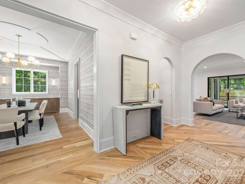 5601 Robinhood Road, Charlotte, NC 28211.  MLS# CAR4258800, YatesRealty ID 13109. Foyer looking into the Formal Dining Room and into the Great Room.  White Oak hardwoods throughout the home.