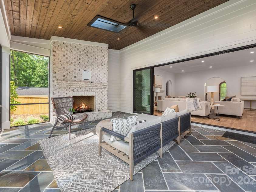 5601 Robinhood Road, Charlotte, NC 28211.  MLS# CAR4258800, YatesRealty ID 13109. Great screen porch with fireplace