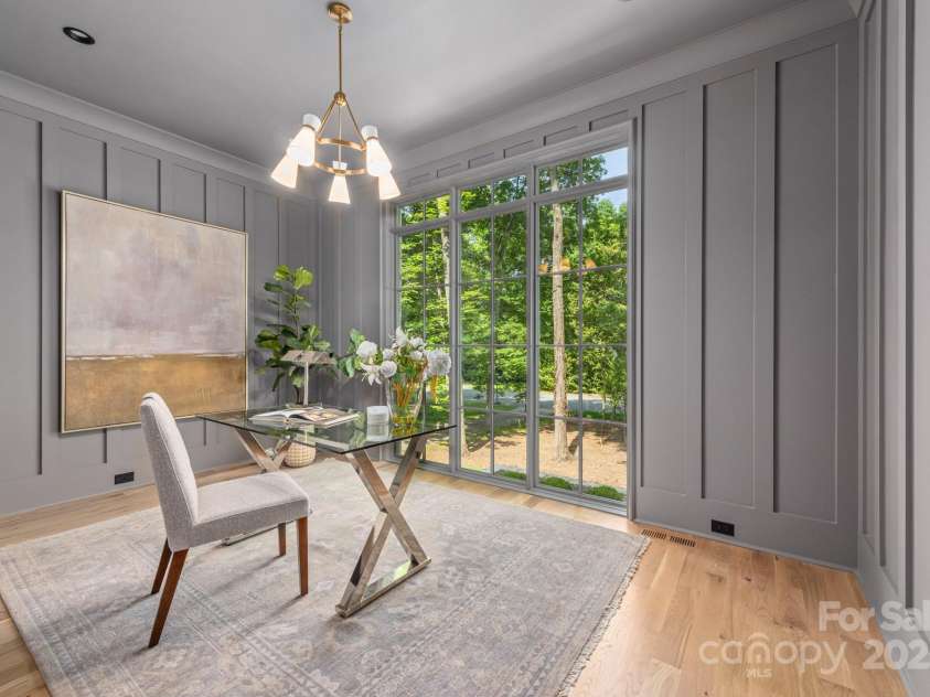 5601 Robinhood Road, Charlotte, NC 28211.  MLS# CAR4258800, YatesRealty ID 13109. Office with paneled walls off of the Primary Bedroom.