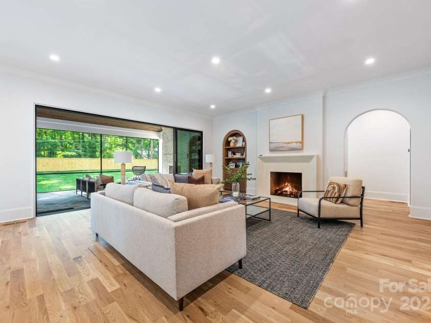 5601 Robinhood Road, Charlotte, NC 28211.  MLS# CAR4258800, YatesRealty ID 13109. Open the sliding doors and connect the outdoors with the indoors on your screen porch with fireplace!