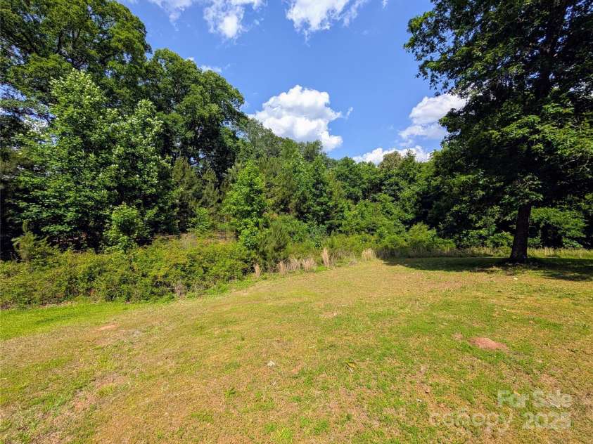 647 Mckay Hill Road, Mount Gilead, NC 27306.  MLS# CAR4259591, YatesRealty ID 13119. Large back yard