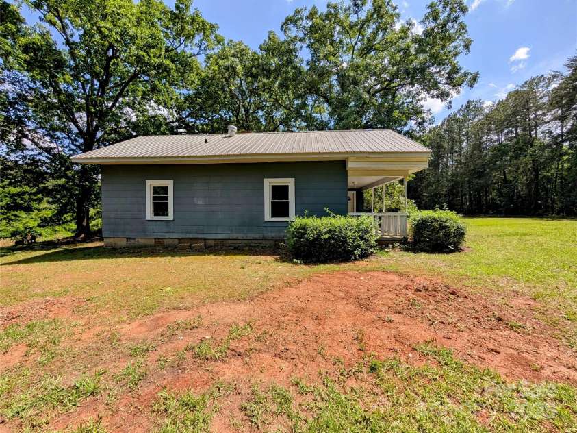 647 Mckay Hill Road, Mount Gilead, NC 27306.  MLS# CAR4259591, YatesRealty ID 13119. Side of house