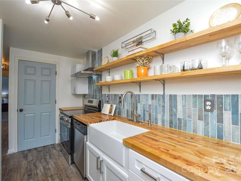 9325 Old Concord Road, Charlotte, NC 28213.  MLS# CAR4276342, YatesRealty ID 13120. Butcher block countertops and floating shelves