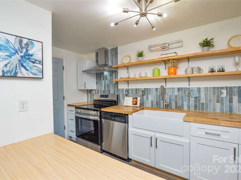 9325 Old Concord Road, Charlotte, NC 28213.  MLS# CAR4276342, YatesRealty ID 13120. Cook while entertaining guests.