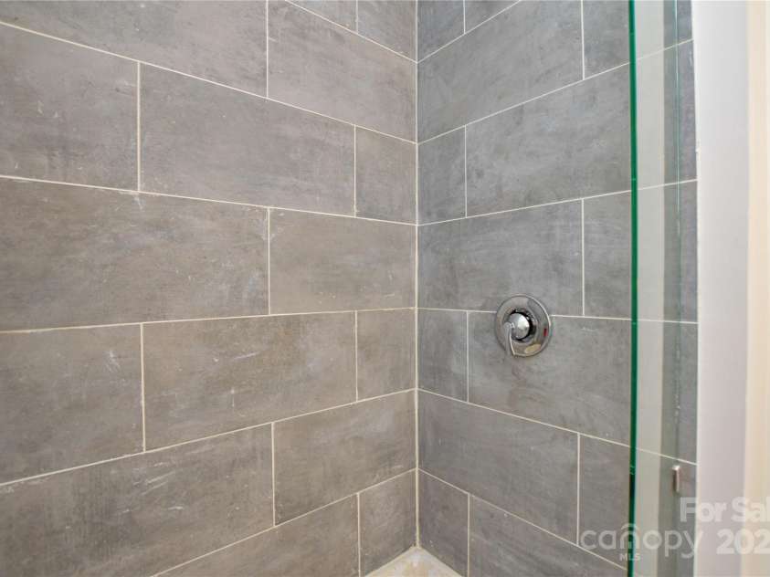 9325 Old Concord Road, Charlotte, NC 28213.  MLS# CAR4276342, YatesRealty ID 13120. Tiled shower. Ensuite bathroom
