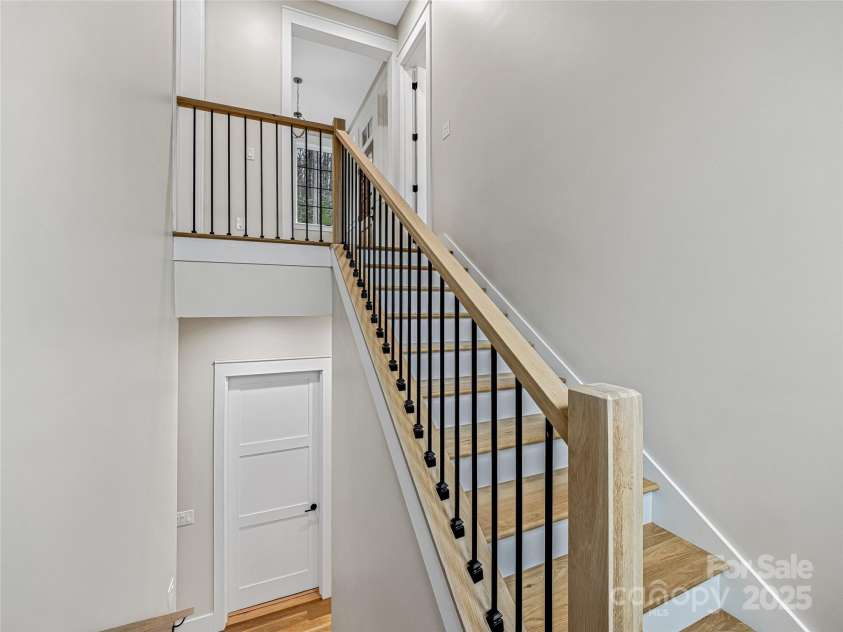 435 Barrington Drive, Asheville, NC 28803.  MLS# CAR4235274, YatesRealty ID 13124. Staircase to basement area