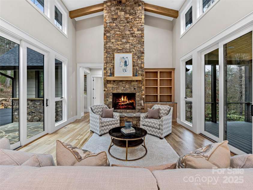 435 Barrington Drive, Asheville, NC 28803.  MLS# CAR4235274, YatesRealty ID 13124. Stone to the ceiling fireplace