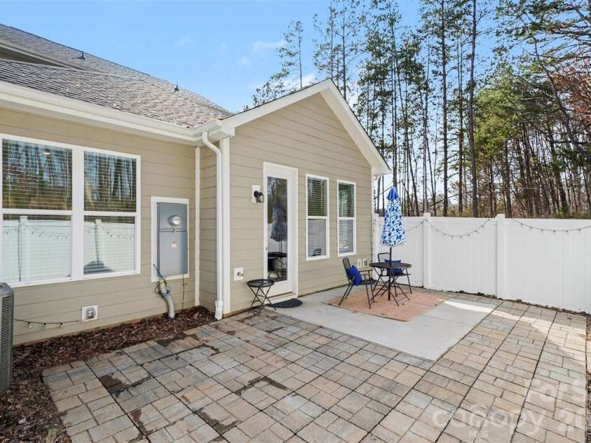 8238 Merryvale Lane, Charlotte, NC 28214.  MLS# CAR4350483, YatesRealty ID 13125. Sizeable patio, fenced and extended with pavers.