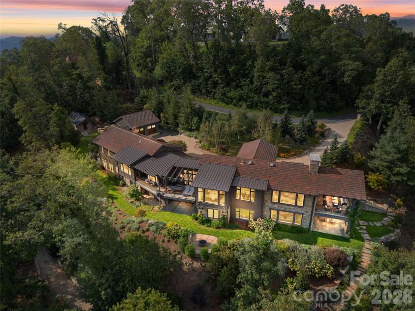 208 Skycliff Drive, Asheville, NC 28804.  MLS# CAR4359719, YatesRealty ID 13129. Drone perspective of the back area of the house 