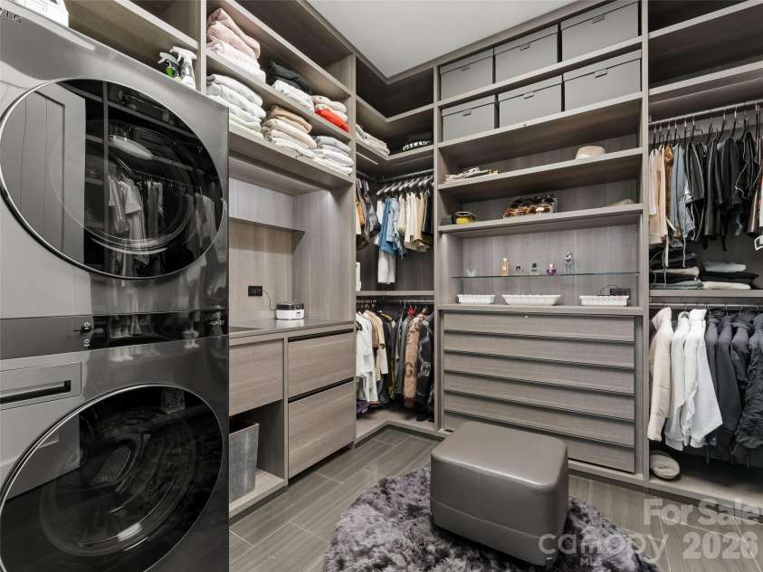 208 Skycliff Drive, Asheville, NC 28804.  MLS# CAR4359719, YatesRealty ID 13129. Primary walk-in closet-hers with Washer and Dryer and 2 refrigerator drawers