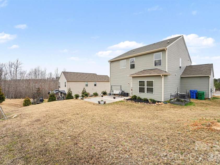 705 Wilshire Drive, Albemarle, NC 28001.  MLS# CAR4351237, YatesRealty ID 13136. Flat backyard with elevation changes that create natural division. 