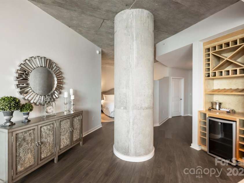 210 Church Street, Charlotte, NC 28202.  MLS# CAR4254825, YatesRealty ID 1314. Architectural column offers separation to bedroom