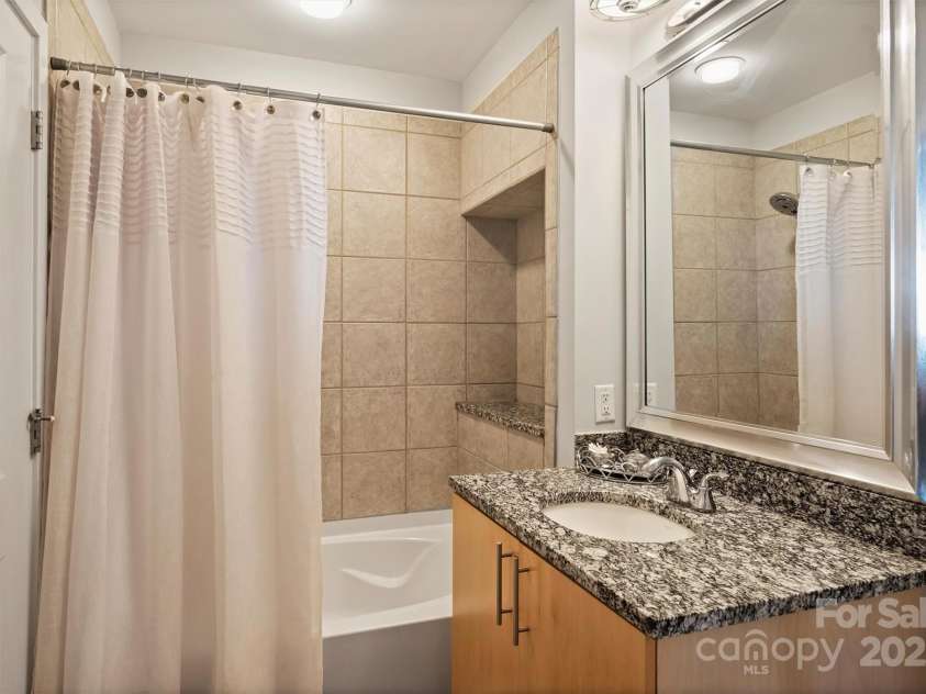 210 Church Street, Charlotte, NC 28202.  MLS# CAR4254825, YatesRealty ID 1314. Ensuite Bathroom, with additional hallway entrance 