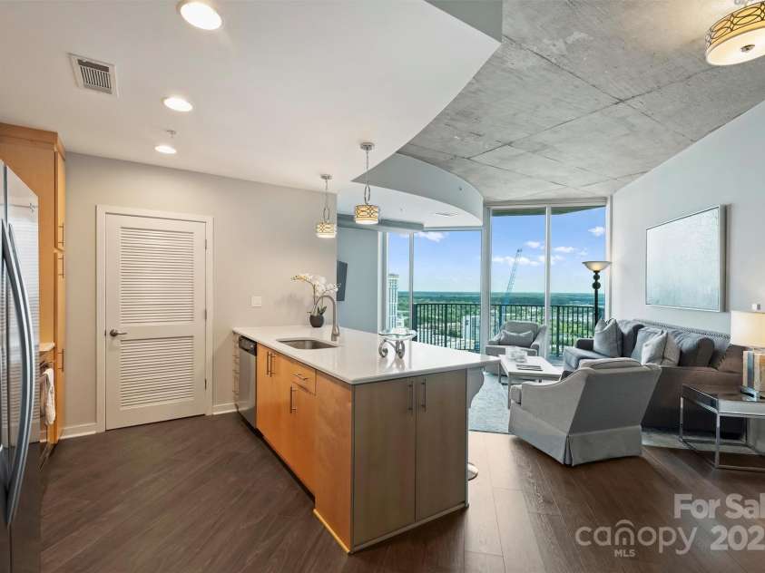 210 Church Street, Charlotte, NC 28202.  MLS# CAR4254825, YatesRealty ID 1314. Open flow for entertaining 