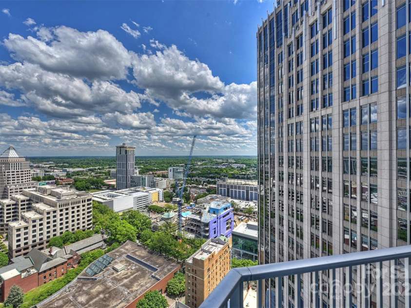 210 Church Street, Charlotte, NC 28202.  MLS# CAR4254825, YatesRealty ID 1314. Overlook the bustling city below 