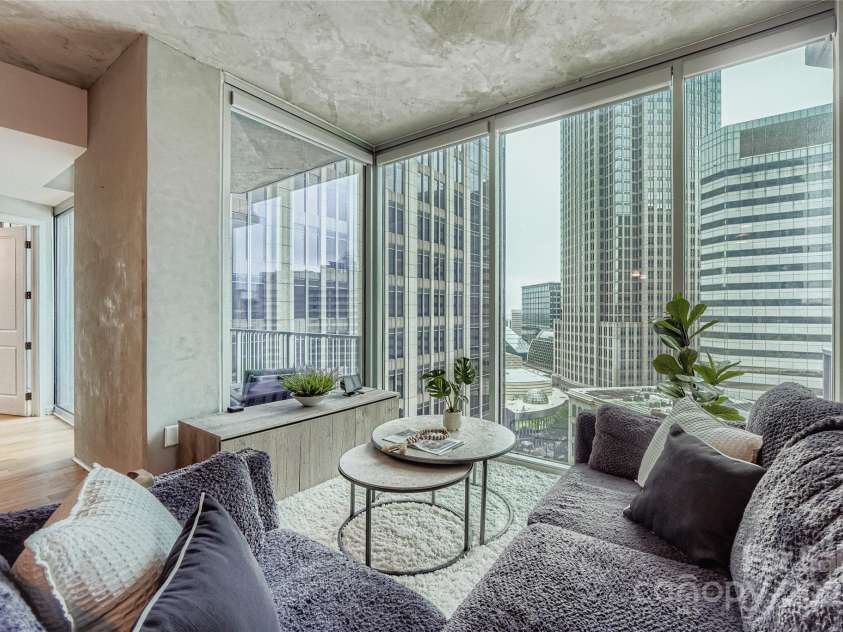 210 Church Street, Charlotte, NC 28202.  MLS# CAR4308241, YatesRealty ID 1314. Enjoy breathtaking views of the city from the living area