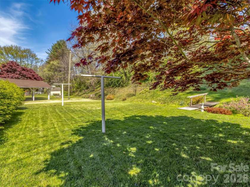 68 Skyview Drive, Waynesville, NC 28786.  MLS# CAR4368765, YatesRealty ID 13140. Sidecyard