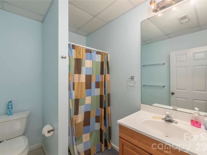 57 Gloria Way, Waynesville, NC 28785.  MLS# CAR4358759, YatesRealty ID 13141. Lower Bathroom