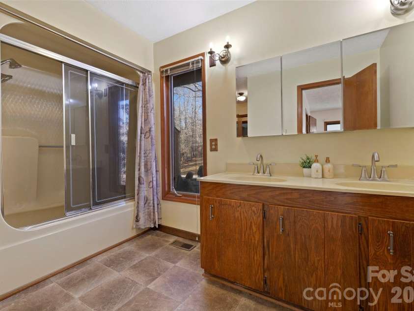 40 Country Bear Lane, Flat Rock, NC 28731.  MLS# CAR4332498, YatesRealty ID 13148. Primary bathroom en-suite