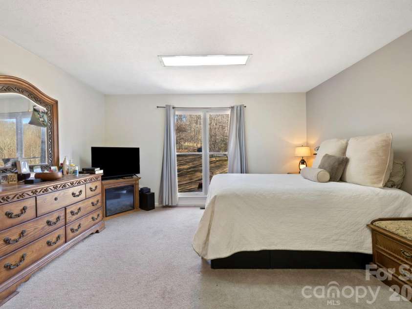 40 Country Bear Lane, Flat Rock, NC 28731.  MLS# CAR4332498, YatesRealty ID 13148. Unit 2 - Primary Bedroom