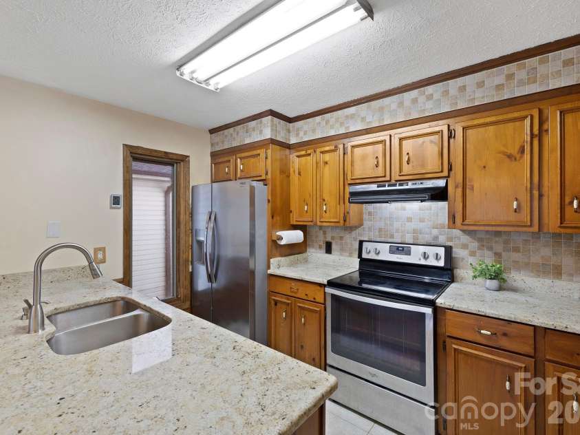 40 Country Bear Lane, Flat Rock, NC 28731.  MLS# CAR4332498, YatesRealty ID 13148. Updated kitchen