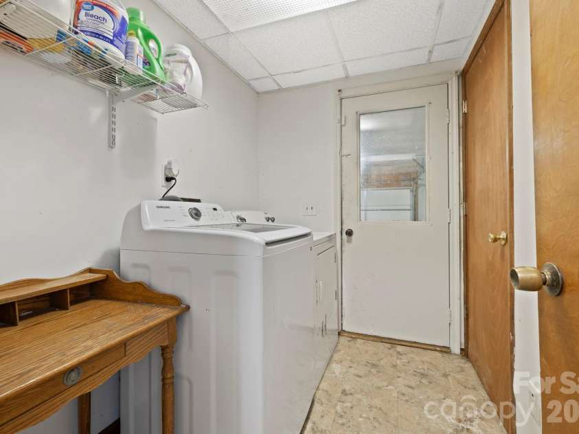40 Country Bear Lane, Flat Rock, NC 28731.  MLS# CAR4332648, YatesRealty ID 13148. Laundry room (W/D convey), closet, and garage entrance