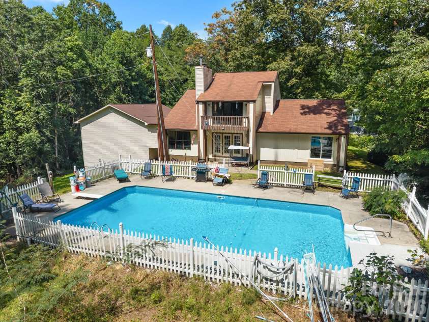40 Country Bear Lane, Flat Rock, NC 28731.  MLS# CAR4420837, YatesRealty ID 13148. Back of Home w/ pool