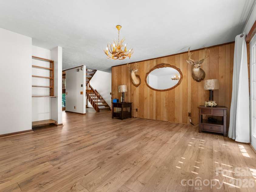 40 Country Bear Lane, Flat Rock, NC 28731.  MLS# CAR4420837, YatesRealty ID 13148. Living Room w/ Fireplace
