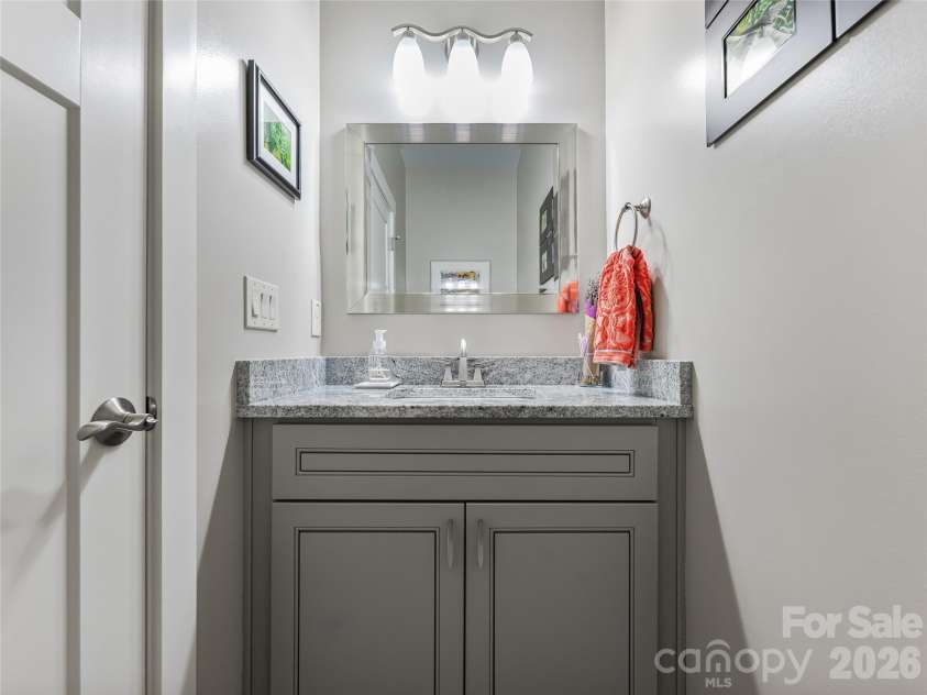 937 Monte Vista Road, Candler, NC 28715.  MLS# CAR4368925, YatesRealty ID 13160. Half Bath with Granite Vanity
