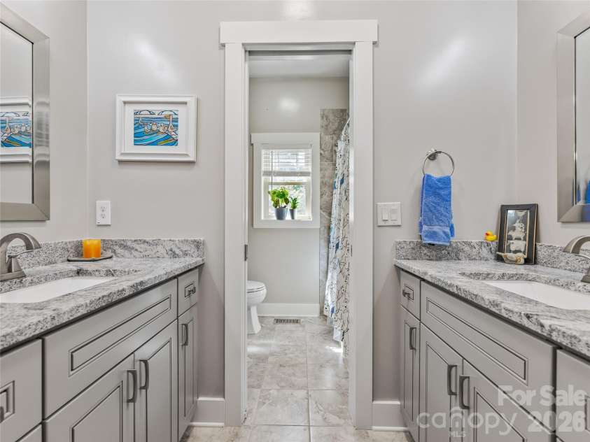 937 Monte Vista Road, Candler, NC 28715.  MLS# CAR4368925, YatesRealty ID 13160. Large shared bath with double granite vanities