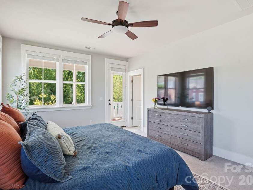 724 Bluff Loop Road, Rock Hill, SC 29730.  MLS# CAR4368937, YatesRealty ID 13163. Spacious primary bedroom with access to private balcony.