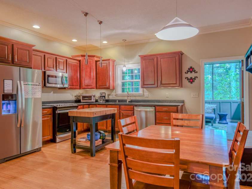 262 Erwin Hills Road, Asheville, NC 28806.  MLS# CAR4255578, YatesRealty ID 13166. Black honed granite counter tops and a gas range