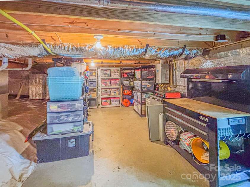 262 Erwin Hills Road, Asheville, NC 28806.  MLS# CAR4255578, YatesRealty ID 13166. Concrete pad for storage shelves