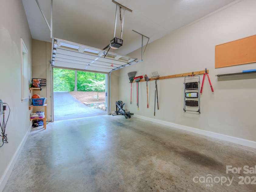 262 Erwin Hills Road, Asheville, NC 28806.  MLS# CAR4255578, YatesRealty ID 13166. This garage boasts high ceilings and an automatic garage door opener
