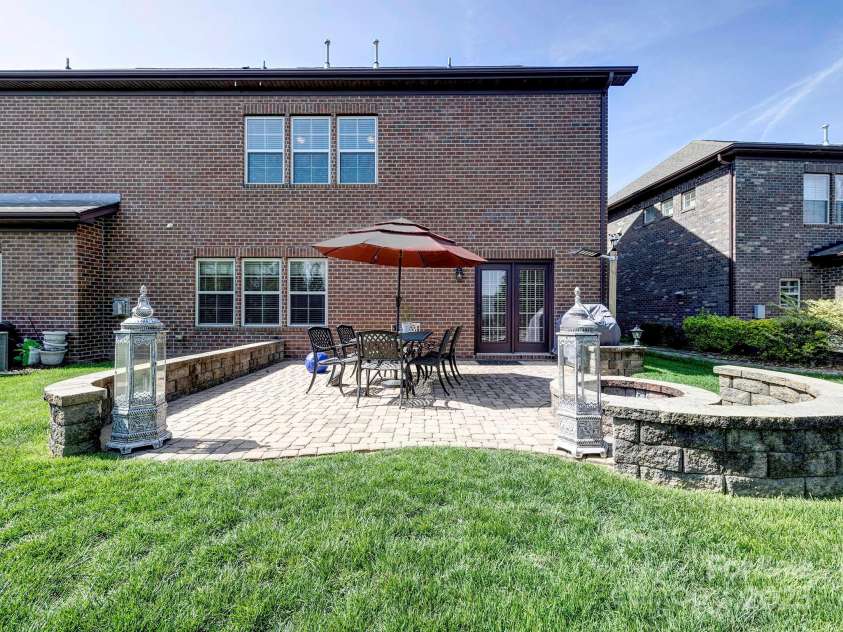 9622 Harvest Pond Avenue, Concord, NC 28027.  MLS# CAR4242006, YatesRealty ID 13192. Custom built patio with firepit