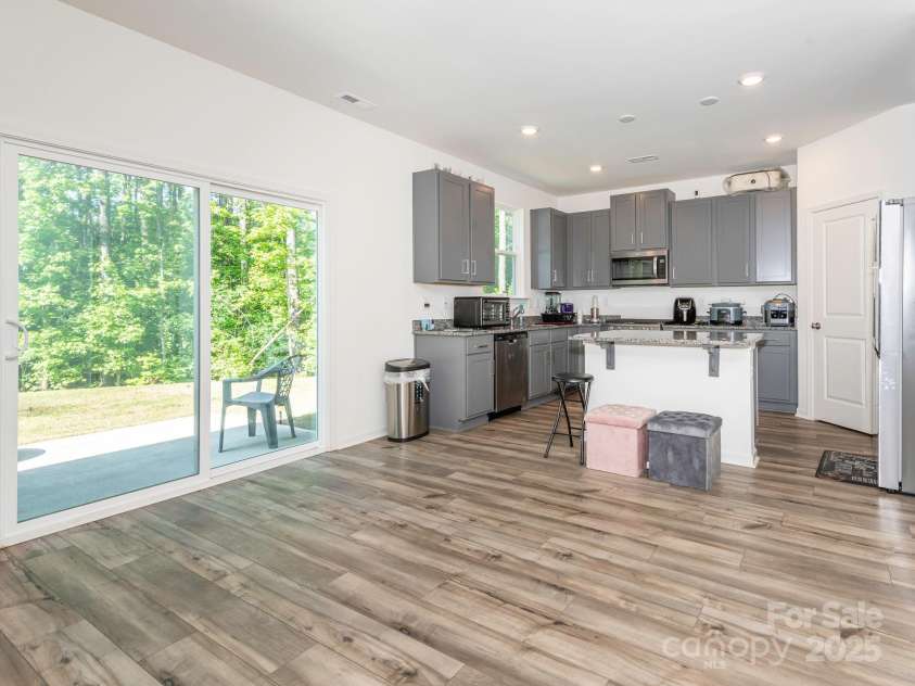 11010 Redcoat Hill Lane, Huntersville, NC 28078.  MLS# CAR4248832, YatesRealty ID 13198. Living Room into kitchen & breakfast