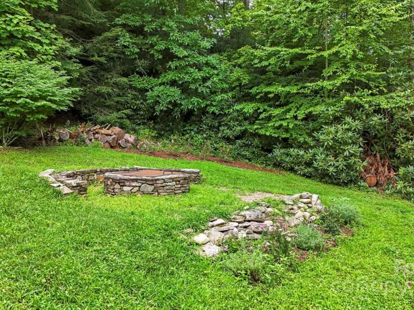 127 Boulder Lane, Blowing Rock, NC 28605.  MLS# CAR4290340, YatesRealty ID 13205. Firepit in front side yard