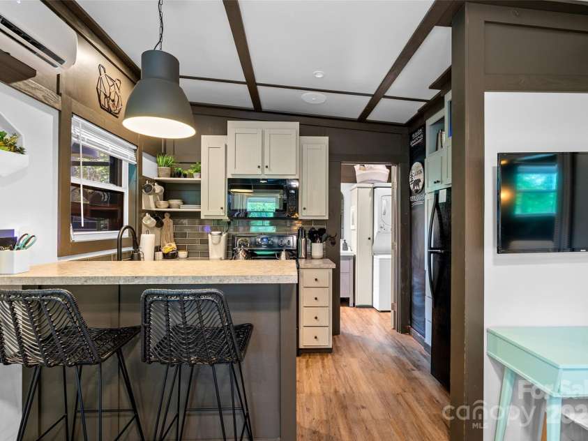 787 Ridge Road, Marion, NC 28752.  MLS# CAR4257578, YatesRealty ID 13209. MAC - Kitchen with island seating + desk area