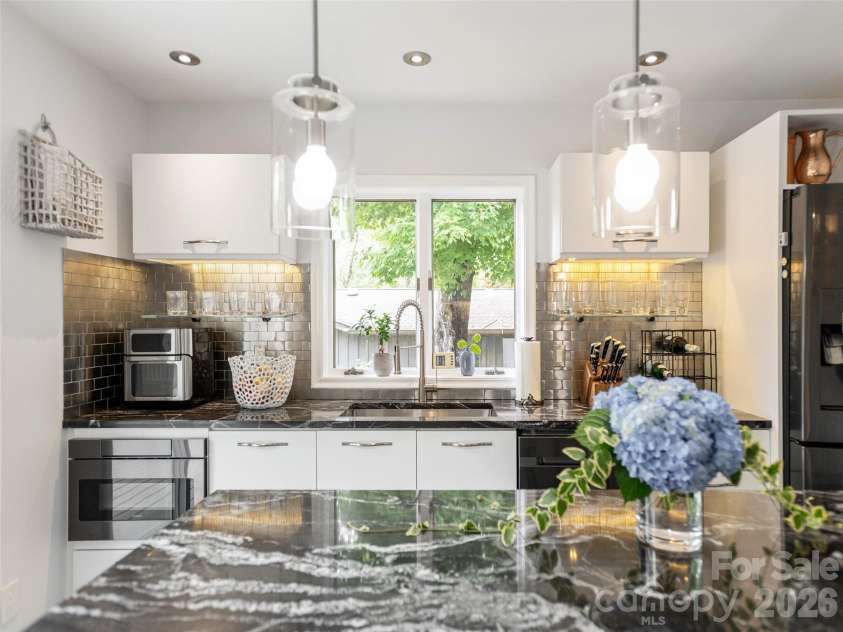 30 Fairway Drive, Etowah, NC 28729.  MLS# CAR4342625, YatesRealty ID 1321. Pendant lighting in kitchen