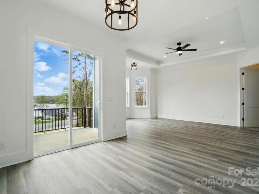 149 Shady Cove Road, Troutman, NC 28166.  MLS# CAR4252387, YatesRealty ID 13223. Sitting area with walkout to patio & waterviews