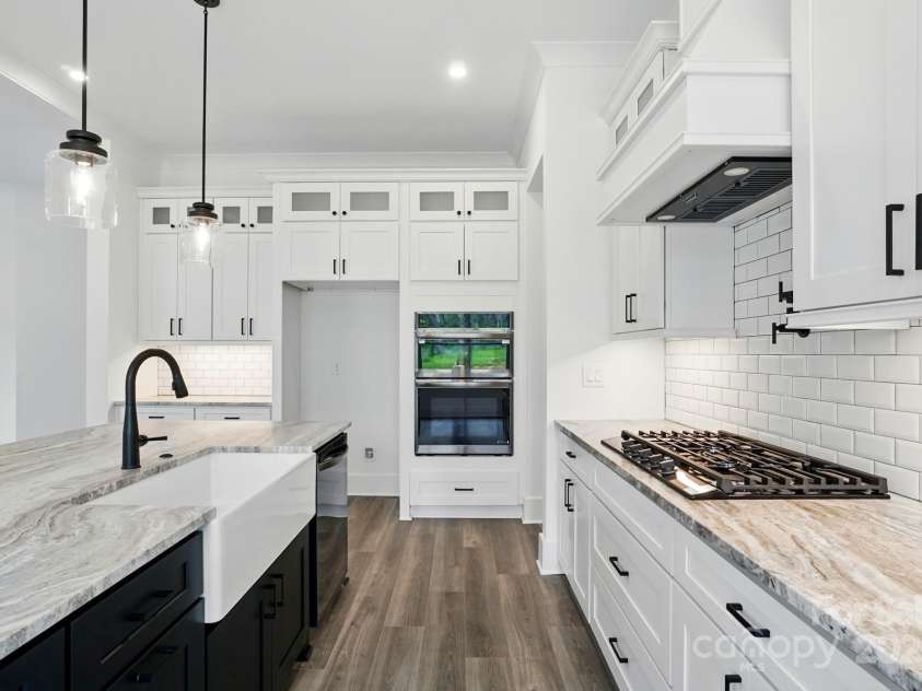 149 Shady Cove Road, Troutman, NC 28166.  MLS# CAR4252387, YatesRealty ID 13223. Stainless steel, matt black fixtures & ceramic sink