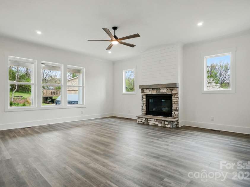 149 Shady Cove Road, Troutman, NC 28166.  MLS# CAR4252387, YatesRealty ID 13223. Stone fireplace in living room