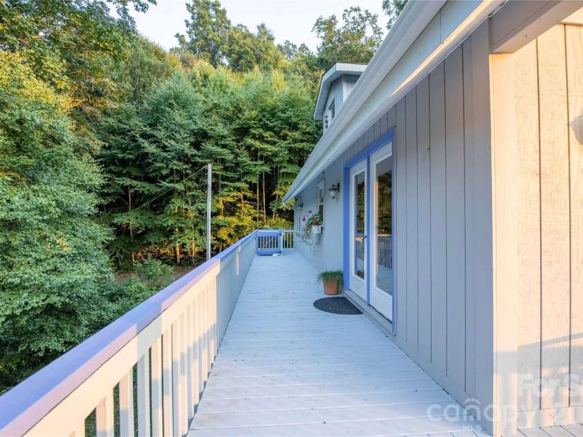 348 Dandelion Lane, Burnsville, NC 28714.  MLS# CAR4340112, YatesRealty ID 13223. Side deck 