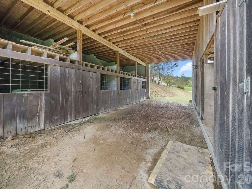 25 Mezzo Cove, Asheville, NC 28804.  MLS# CAR4308363, YatesRealty ID 13232. 4-stall horse barn